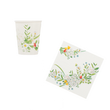 Set di bicchiere e tovagliolo di carta bianchi con fantasia floreale