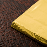 Foglio dorato avvolgi cioccolata su barretta