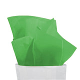 Carta velina verde che esce da un sacchetto bianco