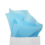 Carta velina azzurra che esce da un sacchetto bianco