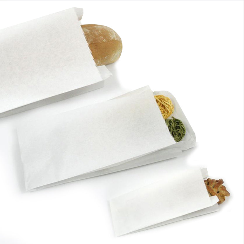 Sacchetti di carta, bianchi, varie misure, pieni di cibo 