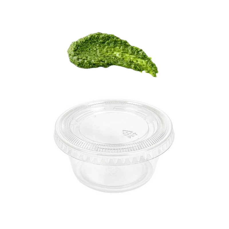 Vaschetta trasparente con coperchio vuota e macchia di salsa verde