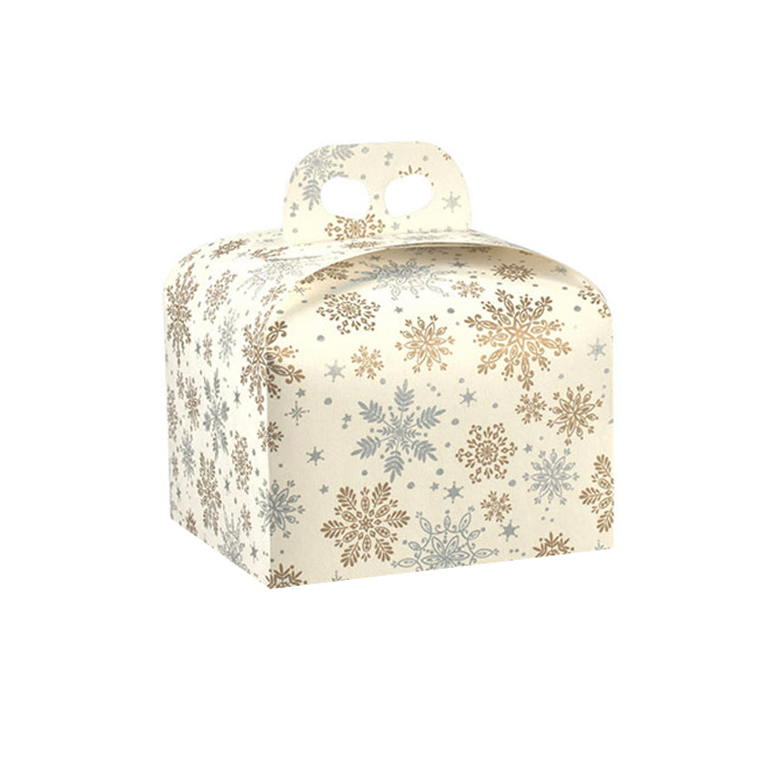 Scatola panettone fantasia di fiocchi di neve oro e argento su sfondo panna