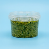 Barattolo a chiusura ermetica tondo, trasparente, pieno di pesto 