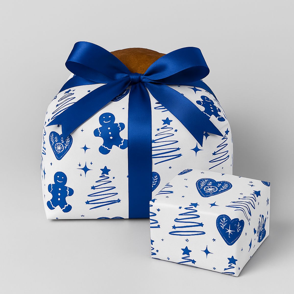 Carta stampata per alimenti, blu, attorno ad una scatola e ad un panettone 