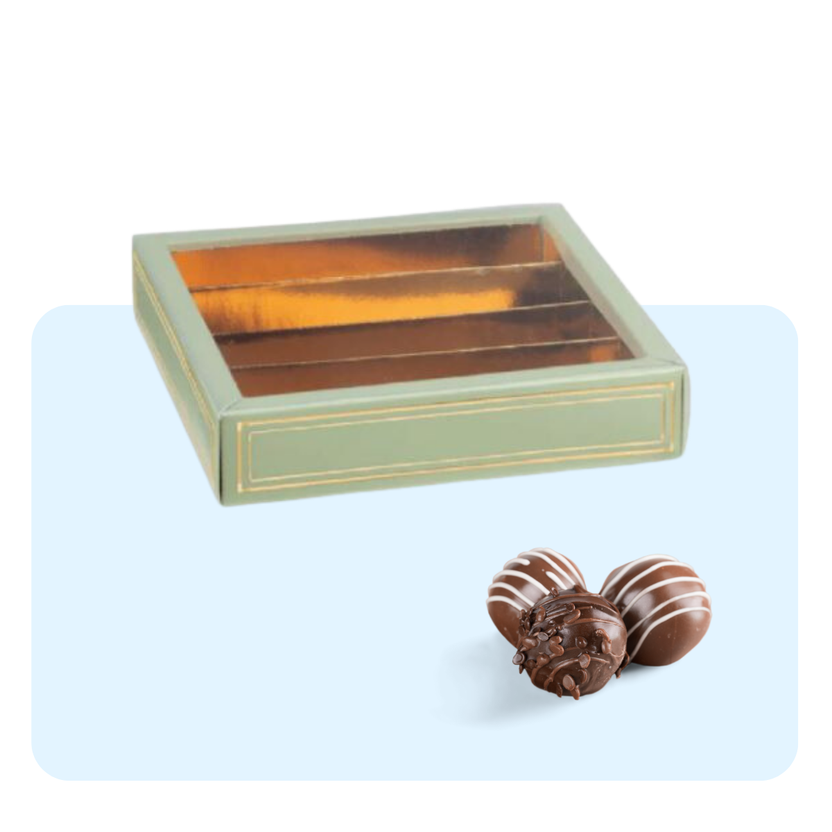 Scatola porta cioccolatini con finestra, vuota e tre praline vicino 