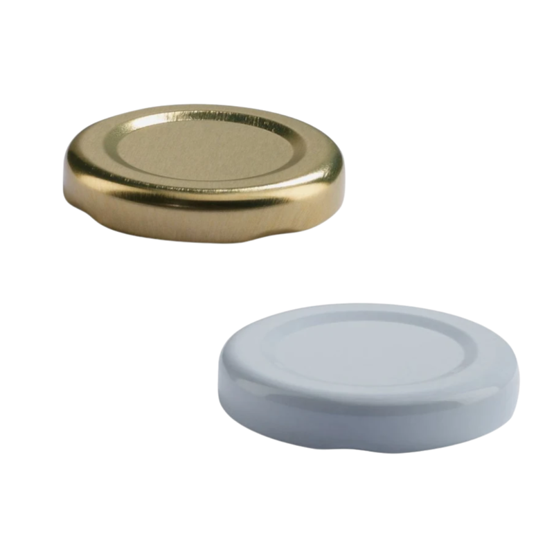 Coperchi per barattoli ermetici, uno color oro d uno bianco 