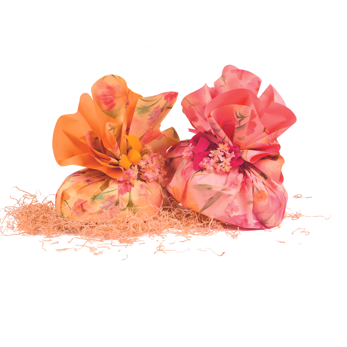 Confezioni pasquali rosa e una giala entrambe con motivi floreali