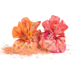 Confezioni pasquali rosa e una giala entrambe con motivi floreali