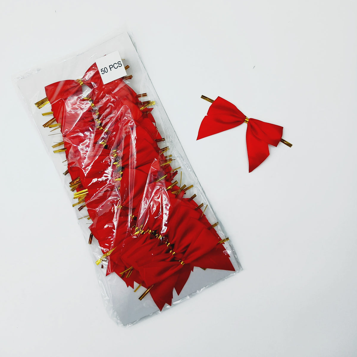 Fiocchetto rosso per confezioni, singolo e nella sua confezione 