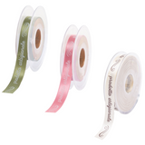 nastri con scritto prodotto artigianale, uno verde, uno rosa ed uno bianco