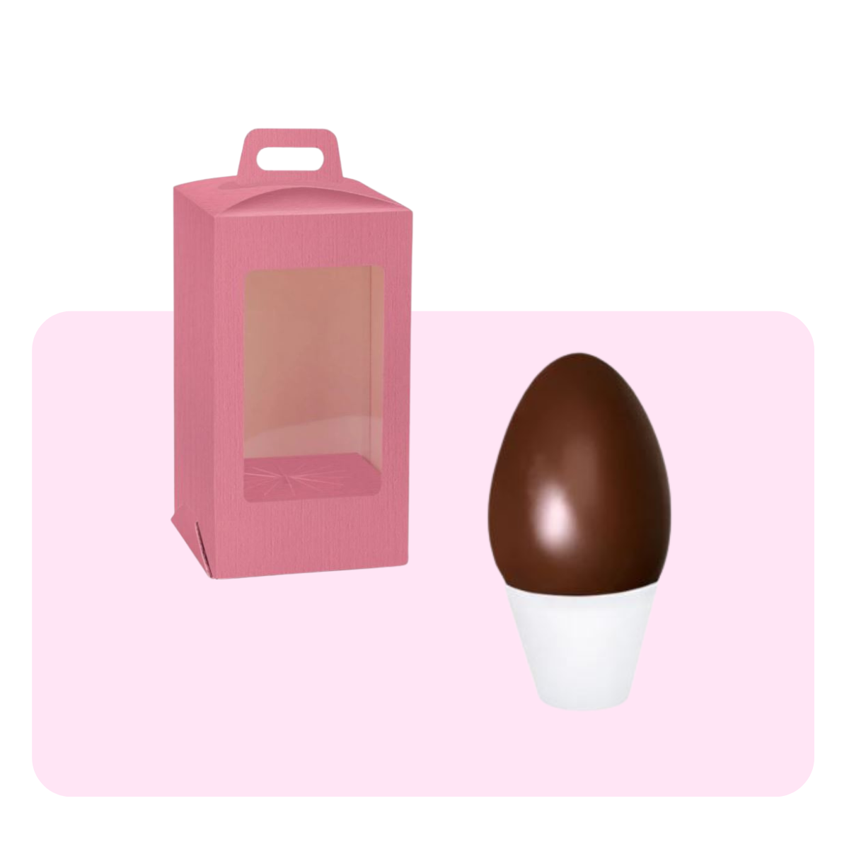 Banner a sfondo rosa, sotto a degli esempi, per scatola rosa con finestra porta uova di pasqua ed un uovo di cioccolato nella base di plastica