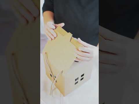 Video con confezione natalizia a forma di casetta 