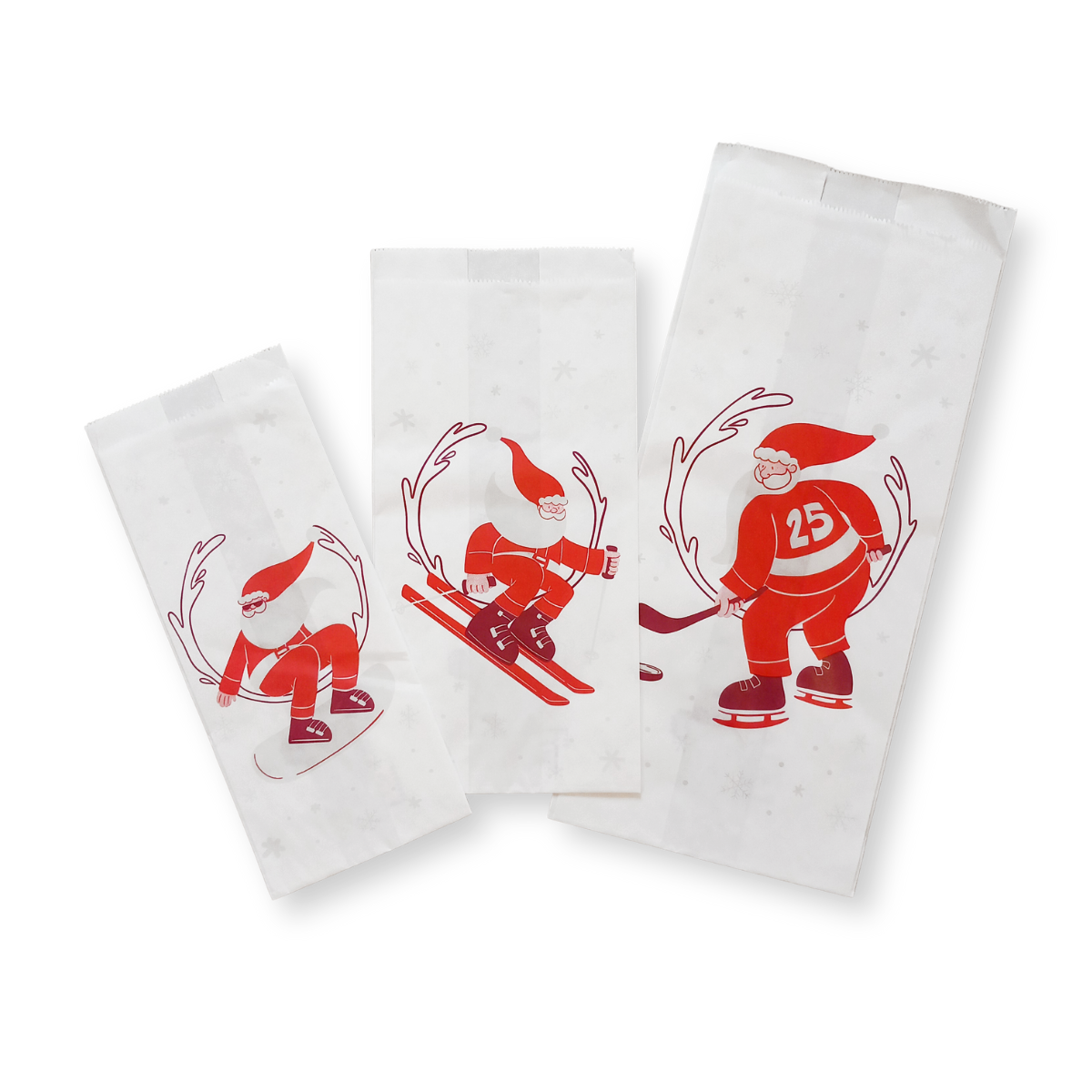 Tre sacchetti di carta bianca con simboli natalizi 