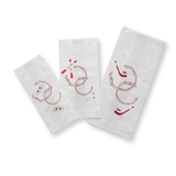 Tre sacchetti di carta bianca con simboli natalizi 