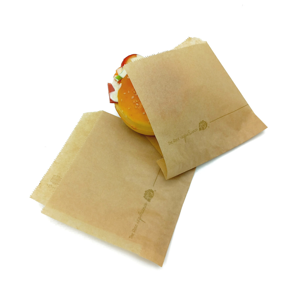 Sacchetto color avana, con dentro un panino, ed uno steso