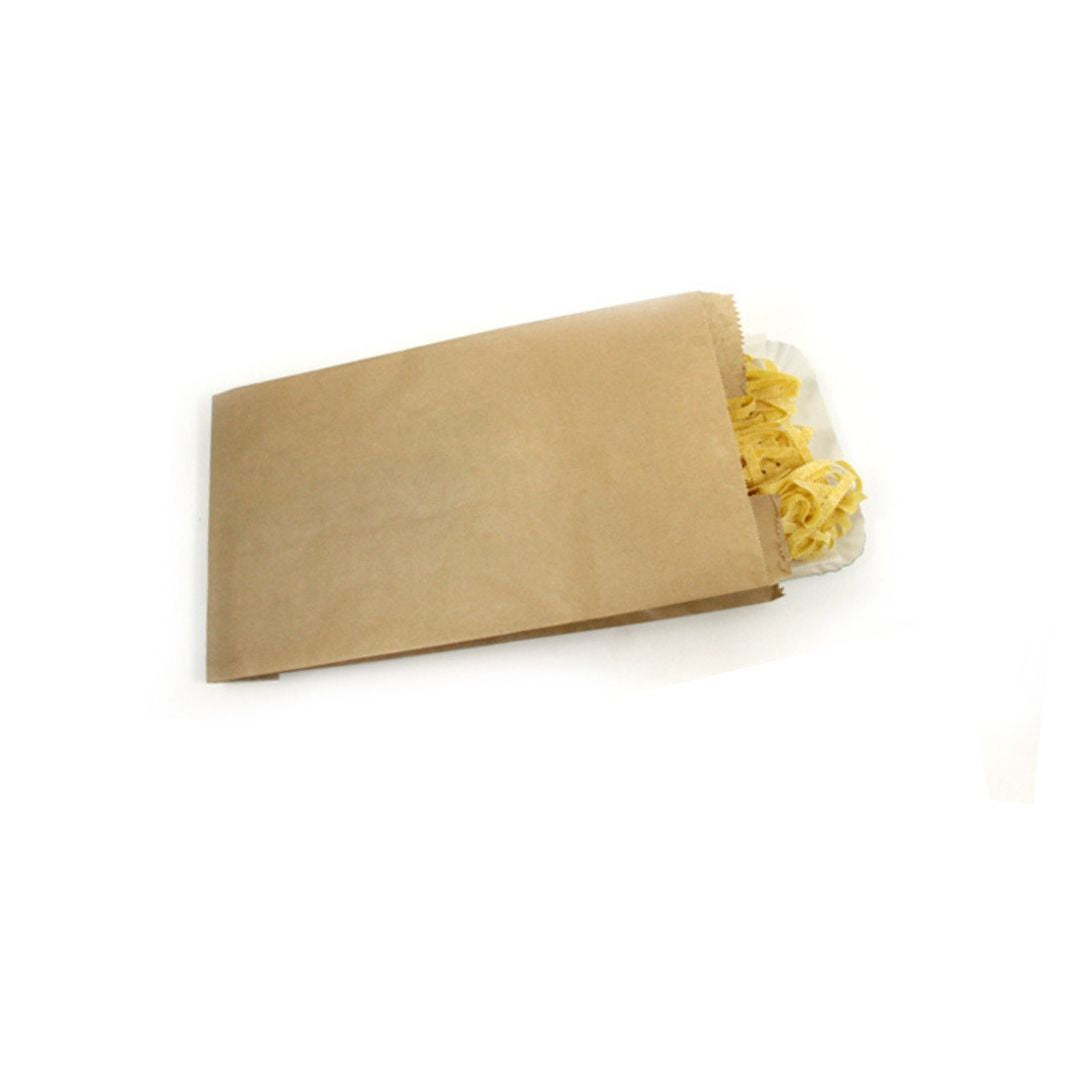 Sacchetto in carta per il pane color avana. con un vassoio di tagliatelle