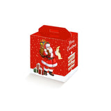 Scatola natalizia rossa con immagine di babbo natale, porta panettone e bottiglia