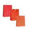Shopper in carta fantasie natalizie sul rosso