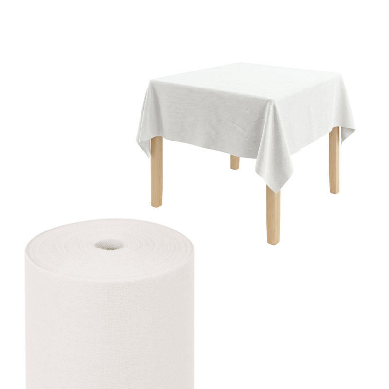 Tavolino di legno con sopra tovaglia monouso  e rotolo color bianco