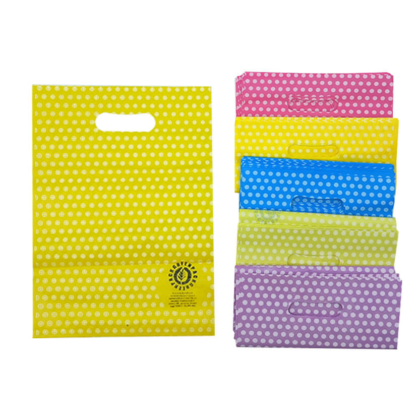 Sacchettini di vari colori, a pois bianchi e manico a fagiolo 