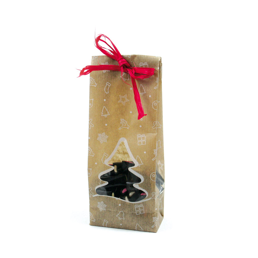 Sacchetto avana con finestra a forma di albero di natale e fantasie bianche natalizie  pieno di liquerizie e con un nastro rosso