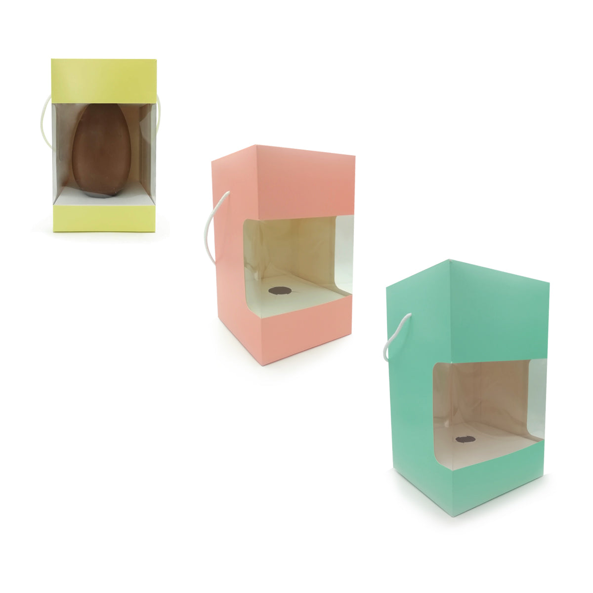 Scatole porta uovo di pasqua di tre colori diversi, con finestra, una ha un uovo dentro