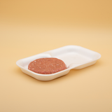 Vaschette per hamburger in polistirolo bianco., due scomparti, con un hamburger dentro 