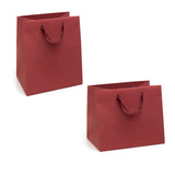Shopper di carta con manico in nastro color rosso bordeaux, due misure diverse