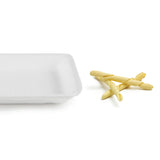 Vassoio bianco in polistirolo con vicino 3 strozzapreti