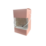 Scatola per uovo di Pasqua di cartone rosa con finestra e manico in cordoncino, vuota