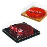 Scatole quadrate con coperchio trasparente una base nera ed una base avana con due torte dentro 