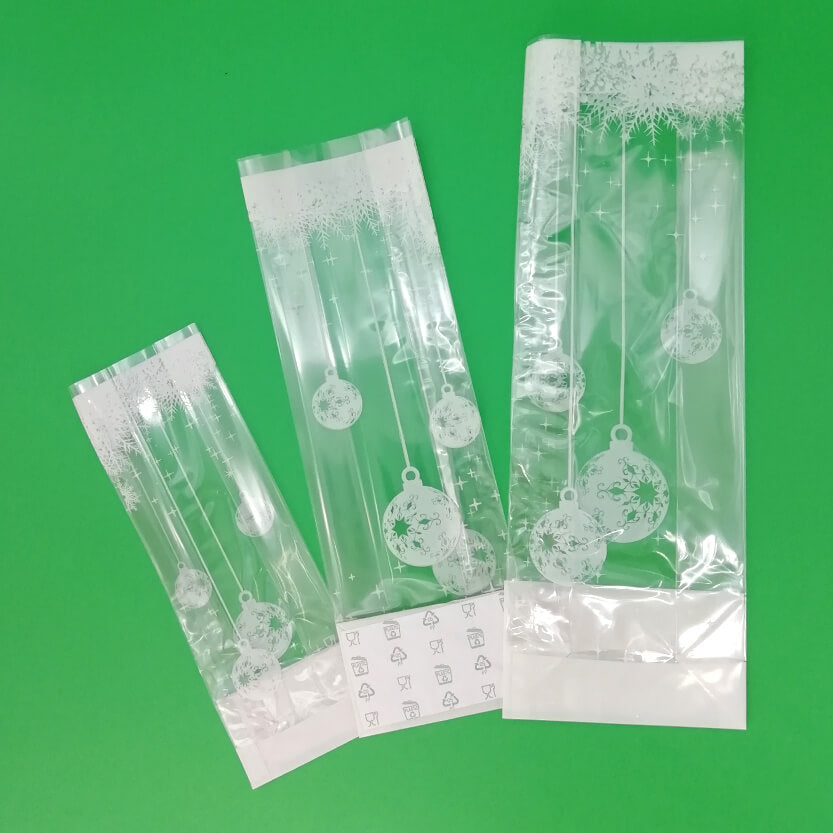 Buste trasparenti con decori bianchi natalizi, a fondo quado, tre diverse misure 