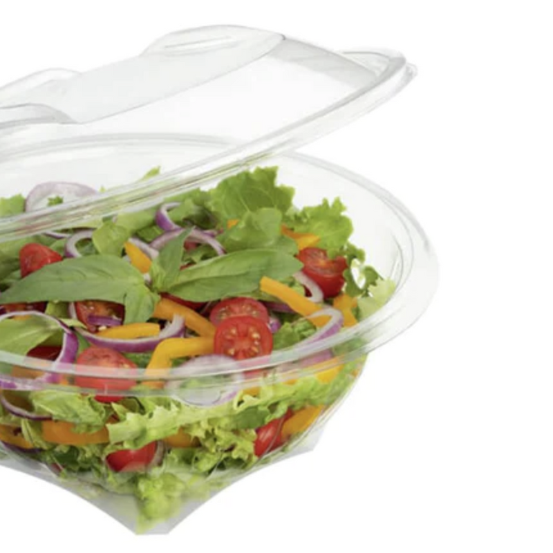 Vaschetta di plastica con coperchio attaccato, piena di insalata 