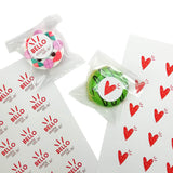 Etichette personalizzate, bello essere con te e cuore, tonde su buste trasparenti e nel loro foglio