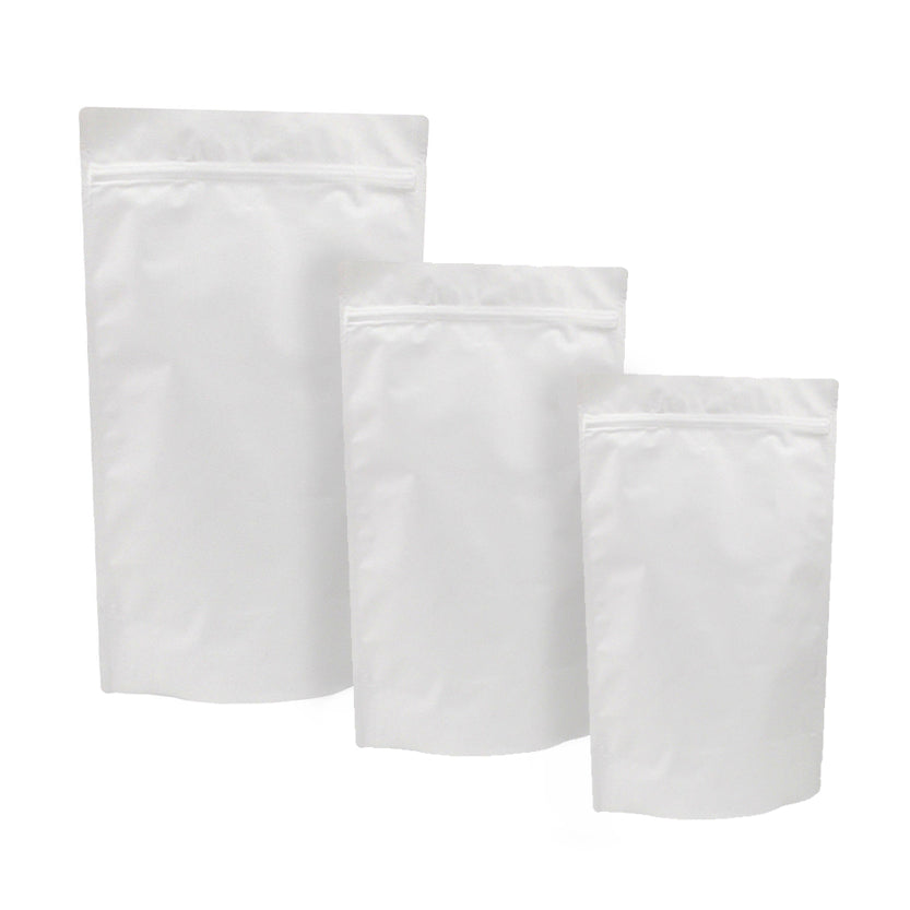 Tre buste, di diverse misure, bianche con zip