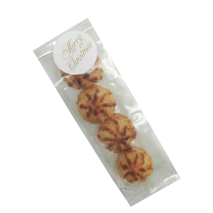 Busta di plastica rettangolare con dolcetti chiusa con etichetta tonda merry christmas
