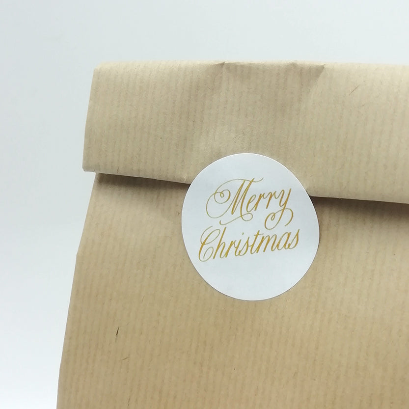 Chiusura sacchetto di carta color avana con etichetta tonda Mery Christmas