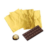 carta alluminio dorata per cioccolato, con barretta di cioccolato e ferrero roche 