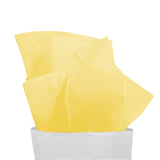 Carta velina gialla che esce da un sacchetto bianco 