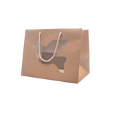 Shopper di carta color avana con finestra a forma di colomba 