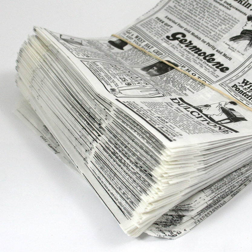 Dettaglio carta antigrasso impilata fantasia giornale
