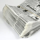 Dettaglio carta antigrasso impilata fantasia giornale