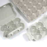 Portauova grigi, aperti, vuoti, varie dimensioni 