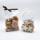 Sacchetti trasparenti a fondo quadro chiusi e con dentro biscotti 