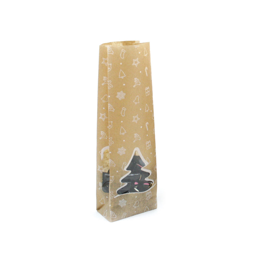 Sacchetto di carta color avana con decori bianchi natalizi e finestra a forma di albero di natale pieno di liquerizie 