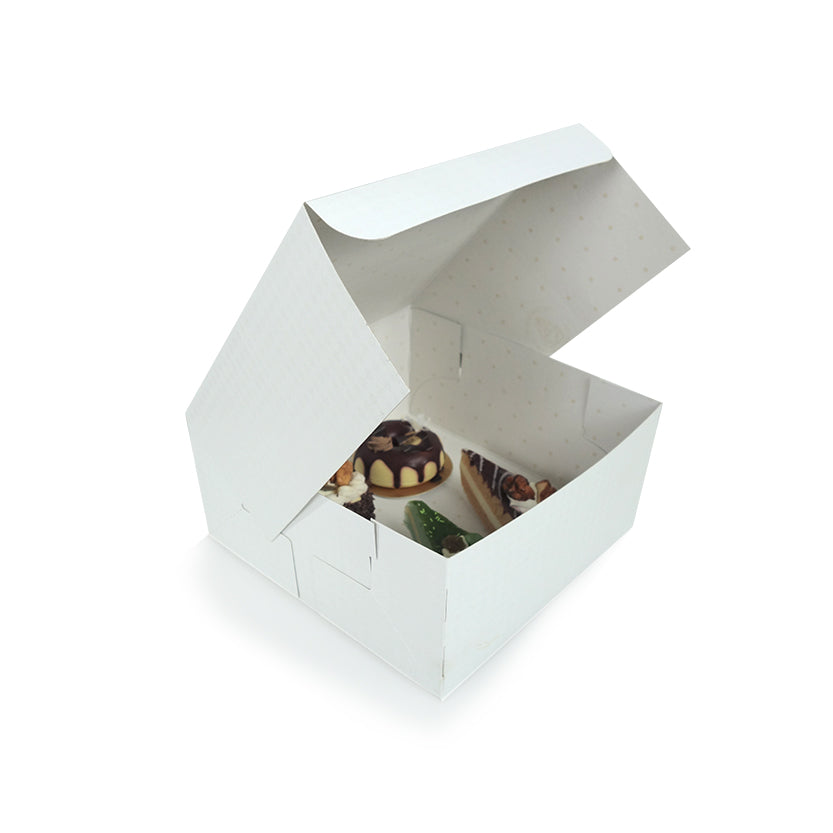 Scatola bianca autonomamente semiaperta con dentropasticcini 